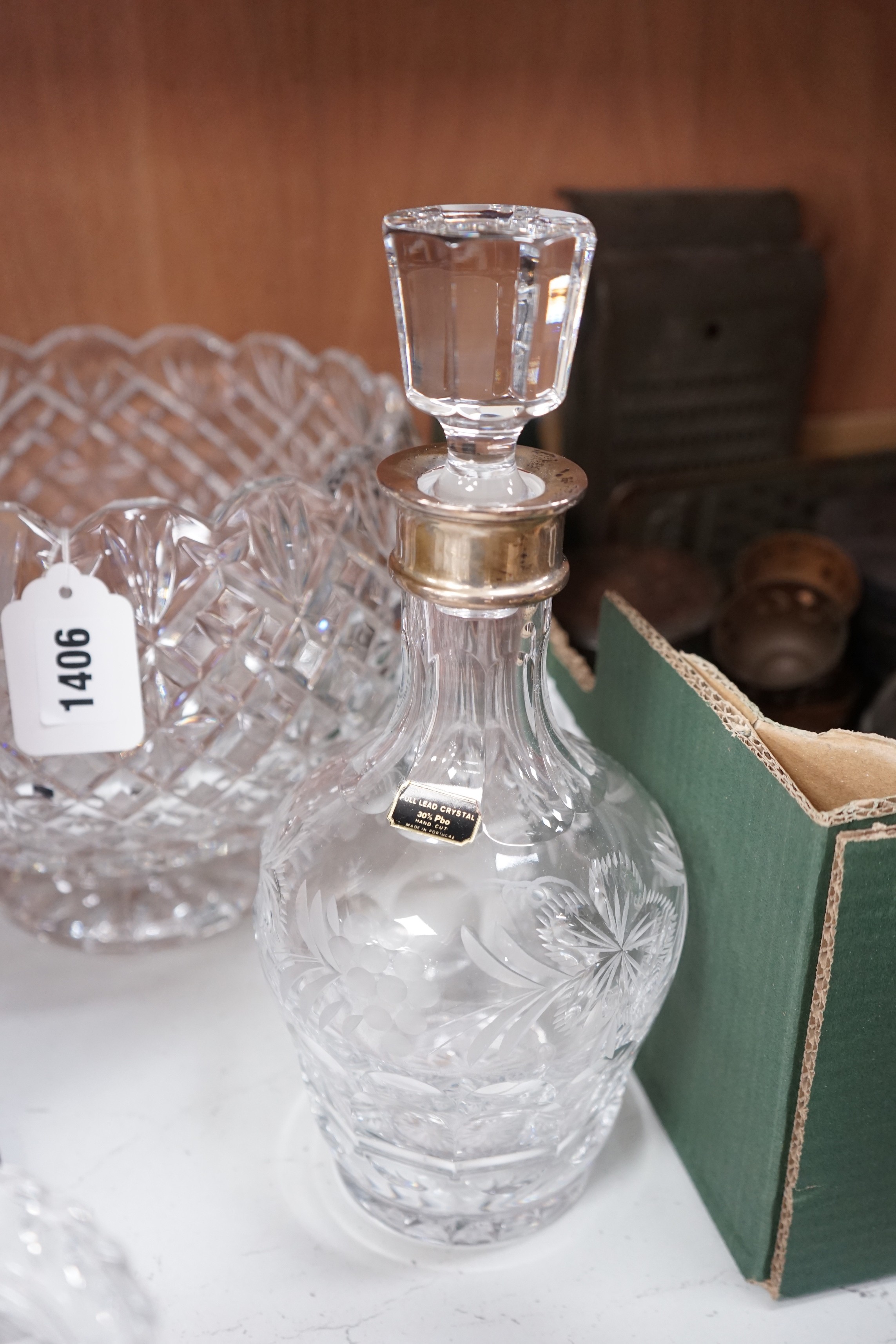 A large Waterford bowl, a biscuit barrel, a decanter with silver neck mount, boxed (Walter Davies) and a Galle style vase, decanter 29cms high